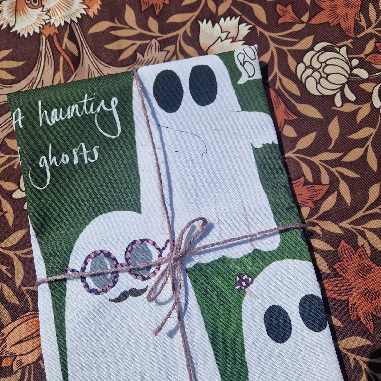 A Haunting Of Ghosts Teatowel